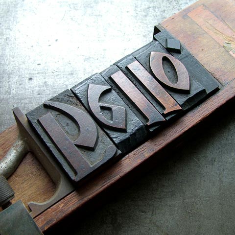 Wooden letters placed in setting stick
