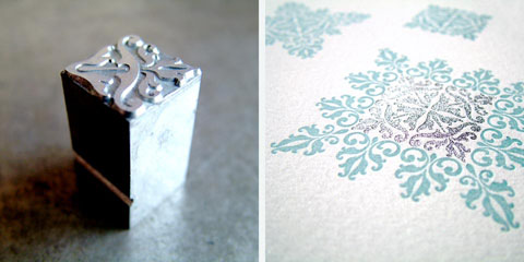 Floral ornament snowflake card in blue and silver detail and fleuron