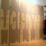 Nick Sherman standing with his 576 lines pica, or 8 feet wood type (image © Nick Sherman 2011)