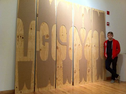 Nick Sherman standing with his 576 lines pica, or 8 feet wood type (image © Nick Sherman 2011) 